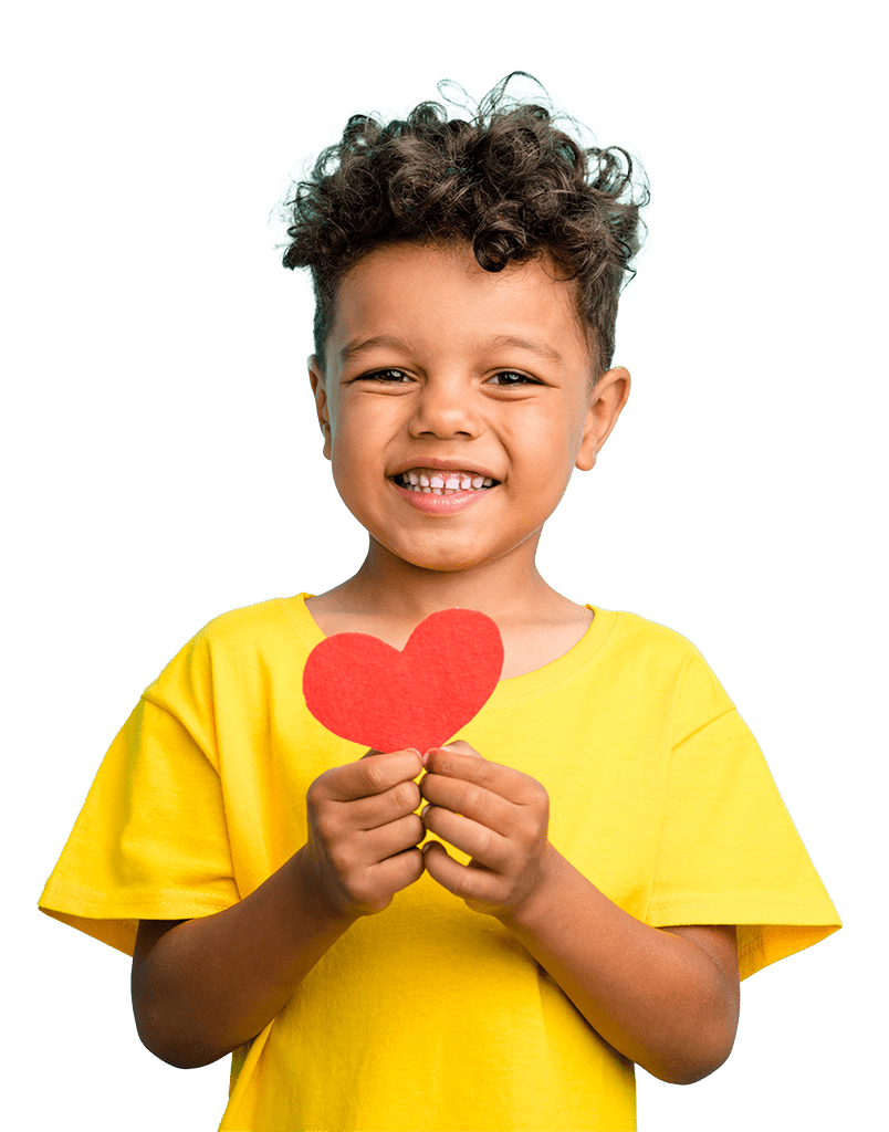 boy in yellow shirt holding a paper heart. We Benefit Children 
